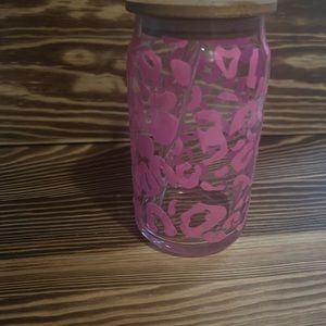 Color changing glass leopard cup turns from pink to blue.